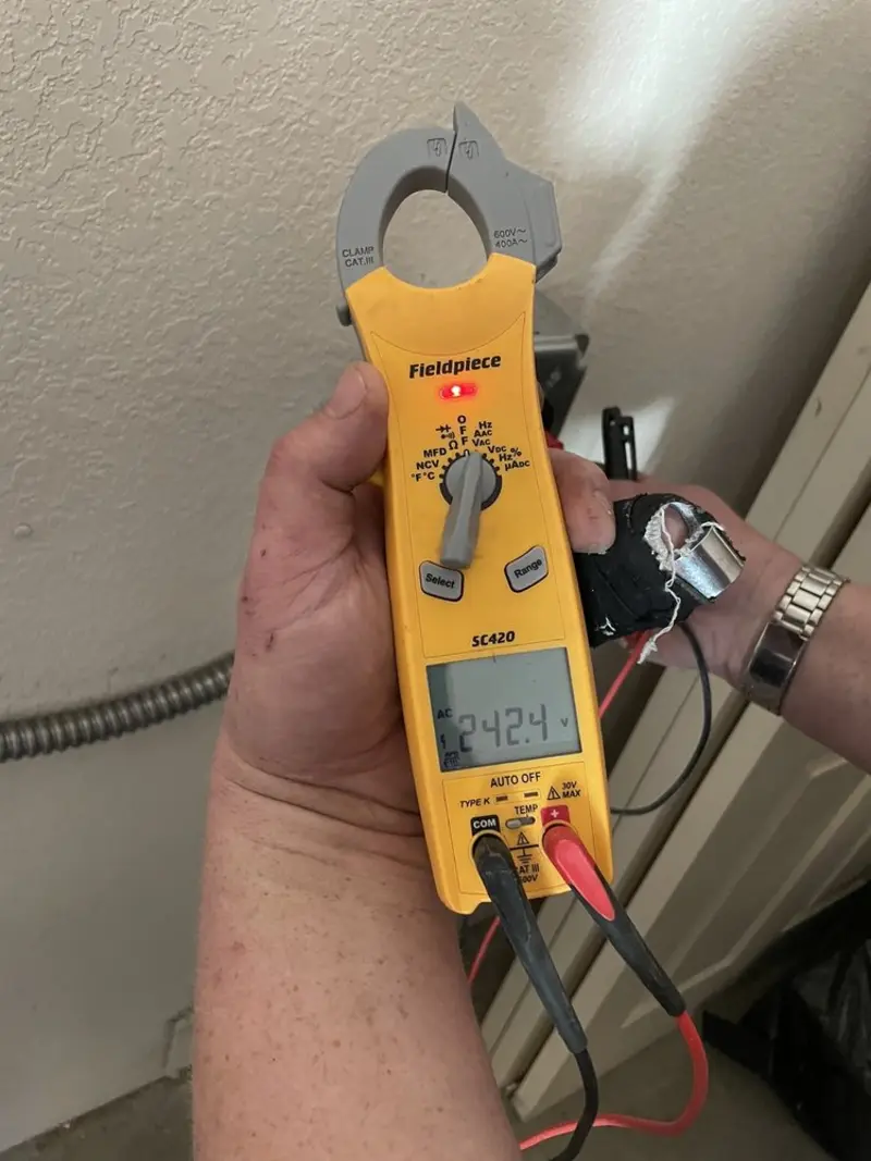 Voltage testing with clamp meter during Electrical Installation Services in Lapeer